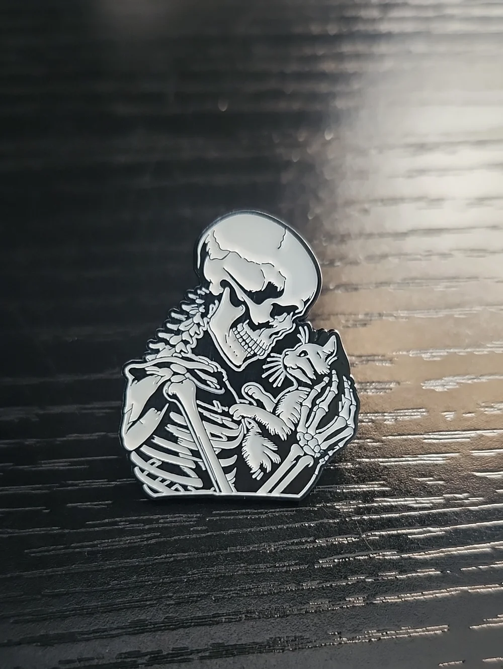 Black & White Skeleton Holding Cat Enamel Pin